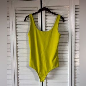 Lime green thong bodysuit.